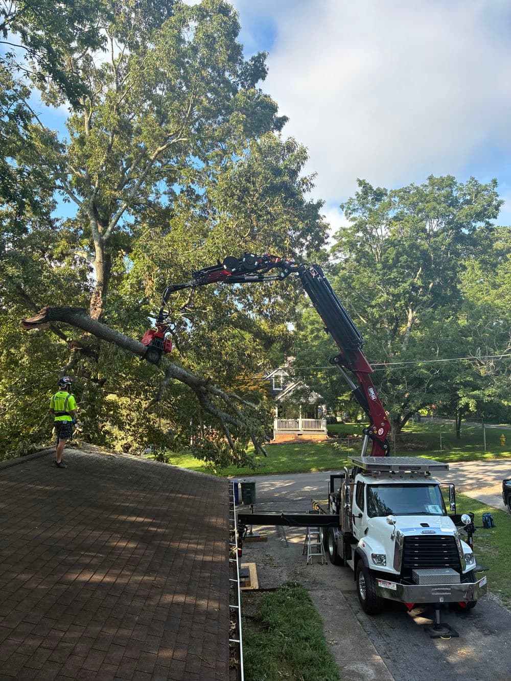 Crane Removal of a Storm Damage Limb Off a Roof in Chattanooga