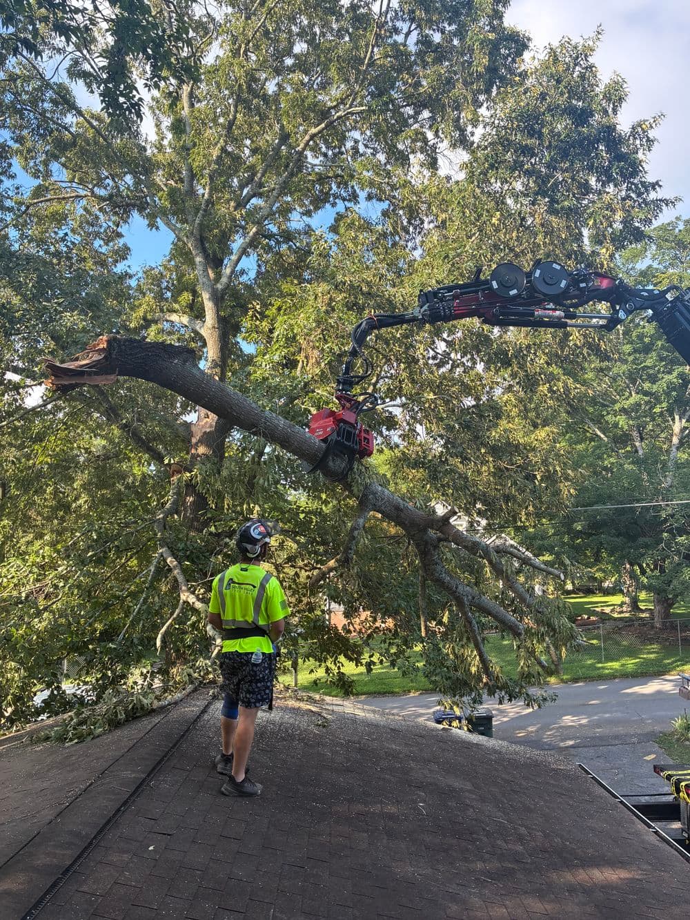 Crane Removal of a Storm Damage Limb Off a Roof in Chattanooga